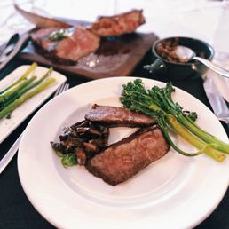 Shared 36oz Bone-in tomahawk steak with wild mushrooms and charred broccolini Shared 36oz Bone-in tomahawk steak with wild mushrooms and charred broccolini