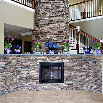 John Henry Tavern - a stone fireplace and staircases - Pubs Near Me - Grafton, Massachusetts