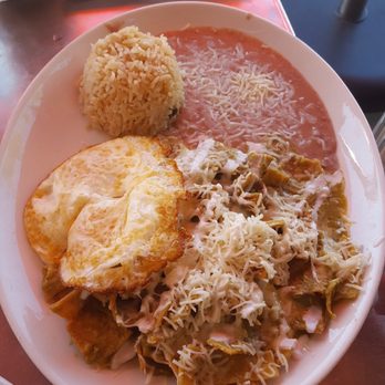 Cafe De Olla - Chiliquilles Poblano with over medium eggs and rice and beans. Delicious! - American Near Me - Burbank, California Cafe De Olla - Chiliquilles Poblano with over medium eggs and rice and beans. Delicious! - American Near Me - Burbank, California