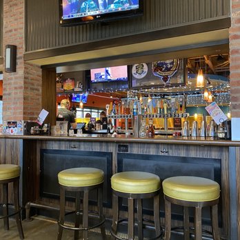 Pizza Lucé - a bar with stools and a television - Pizza Near Me - Richfield, Minnesota Pizza Lucé - a bar with stools and a television - Pizza Near Me - Richfield, Minnesota