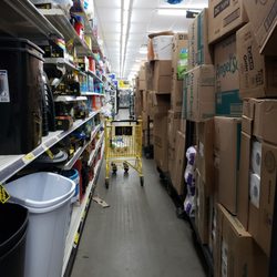 You can't see ANY of the items being displayed on the shelves behind the stacked boxes.