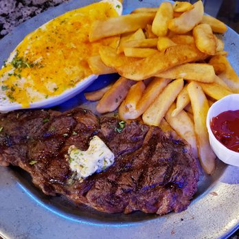 Heroes Bar & Grill - Ribeye. Side of Mac & Cheese and Fries. Very good meal! - New American Near Me - Fullerton, California Heroes Bar & Grill - Ribeye. Side of Mac & Cheese and Fries. Very good meal! - New American Near Me - Fullerton, California