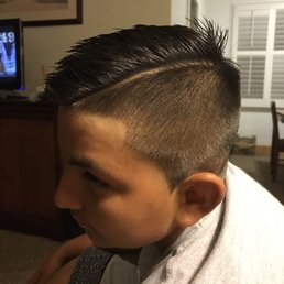 Fresh cut, pointy sideburns, nice fade