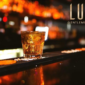 Lust Gentlemen's Club - a glass of alcohol on a bar - Cocktail Bars Near Me - Dayton, Ohio Lust Gentlemen's Club - a glass of alcohol on a bar - Cocktail Bars Near Me - Dayton, Ohio