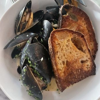 Jacques - a plate of steamed mussels and bread - French Near Me - Denver, Colorado