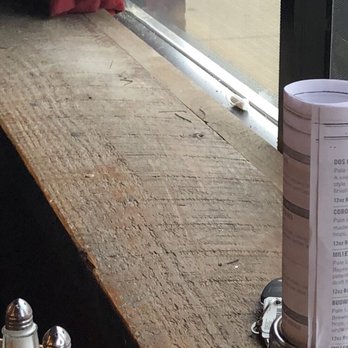 Ballydoyle Irish Pub - Our dining table, by window, with view of an opened tampon! - Irish Pub Near Me - Aurora, Illinois