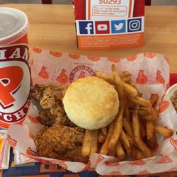 My 6 piece Cajun wing dinner with fries, red beans and rice, biscuit and an ice tea for $8.67. Super yummy!