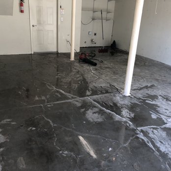 Angel's Paint & Epoxy - Before. Bare concrete with lots of cracks and oil stains. - Flooring Near Me Angel's Paint & Epoxy - Before. Bare concrete with lots of cracks and oil stains. - Flooring Near Me