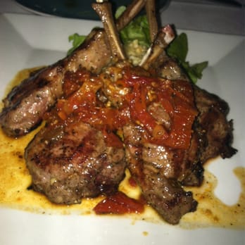Global Grill - Lamb Lollipops Israeli Coiscous Cake & Sundried tomatoe jus - New American Near Me - Pensacola, Florida Global Grill - Lamb Lollipops Israeli Coiscous Cake & Sundried tomatoe jus - New American Near Me - Pensacola, Florida