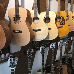Musamaailma - Acoustic guitars department: Larrivée, Tanglewood, Admira Spanish classical guitars...