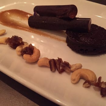 Sepia - The acho chocolate mousse, flourless cake, almonds and dates. - New American Near Me - Chicago, Illinois Sepia - The acho chocolate mousse, flourless cake, almonds and dates. - New American Near Me - Chicago, Illinois
