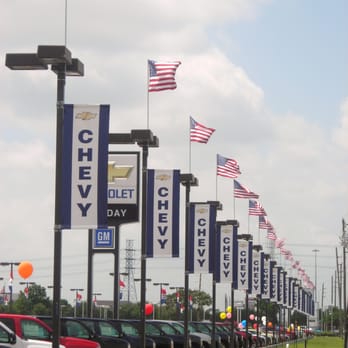 Texas Flag & Banner Company - Chevy Pole Banners & U.S. Flags at Munday Chevrolet in Sping Texas - Screen Printing Near Me - Spring, Texas Texas Flag & Banner Company - Chevy Pole Banners & U.S. Flags at Munday Chevrolet in Sping Texas - Screen Printing Near Me - Spring, Texas
