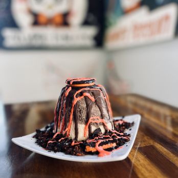 Vampire Penguin - a chocolate cake with orange icing and sprinkles - Shaved Snow Near Me - Arlington, Washington