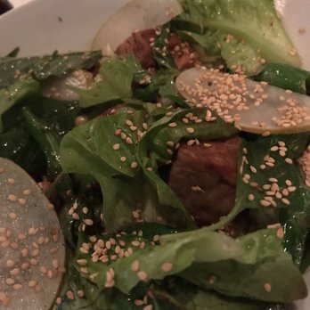 FIG - Suckling Pig entree! It is a salad with three tiny pieces of pork. - New American Near Me - Charleston, South Carolina