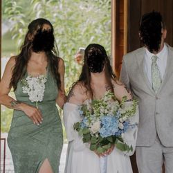 Sunset Ridge Farm wedding/event venue - Owner's arm & phone.