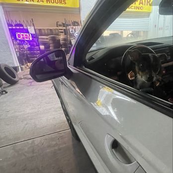 Tire Rangers - Puppy and popped tire getting repaired at Tire Rangers - Tires Near Me - Inglewood, California Tire Rangers - Puppy and popped tire getting repaired at Tire Rangers - Tires Near Me - Inglewood, California