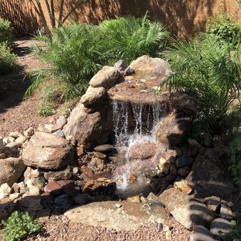 Castcade Arizona - a small waterfall in a garden - Landscape Architects or Designers Near Me
