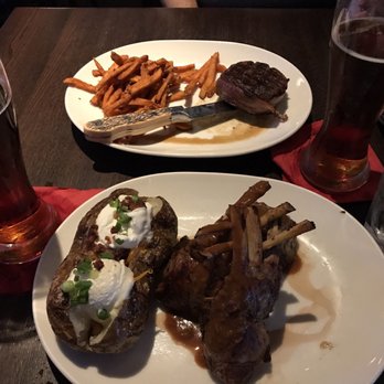 FireRock Steakhouse - Rack of Lamb w/ Colossal Baked Potato & Bacon - Wrapped Filet w/ Sweet Potato Fries - Steakhouses Near Me - Casper, Wyoming