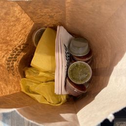 To go bag - they were very generous with sauce! To go bag - they were very generous with sauce!