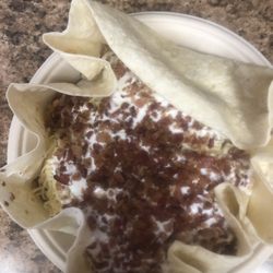 QDOBA Mexican Eats - Naked Burrito with ground beef, bacon, brown rice, black beans, cheese and sour cream with queso on the side it's my favorite.
