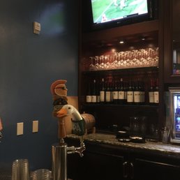 a bar with a television in the background a bar with a television in the background