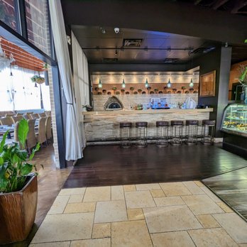 Zafron Restaurant - Inside. Bar, pastry display, and side dining room. - Persian/Iranian Near Me - Sandy Springs, Georgia