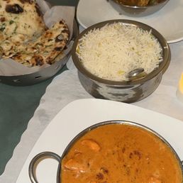 Tikka masala with garlic naan, basmati rice, achari chicken Tikka masala with garlic naan, basmati rice, achari chicken