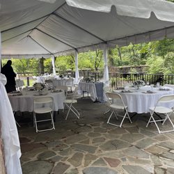 Cabell's Mill - Stone patio covered with a white tent. There