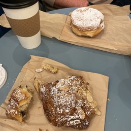two pastries and a cup of coffee two pastries and a cup of coffee