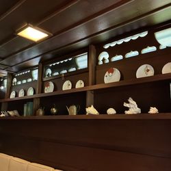 Weltzheimer/Johnson House - Woodwork cutout and dishes matching the design