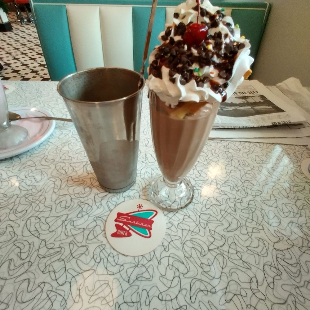 Sunliner Diner - Milkshake comes with a mini waffle triangle and all that you see on top - Diners Near Me - Orange Beach, Alabama Sunliner Diner - Milkshake comes with a mini waffle triangle and all that you see on top - Diners Near Me - Orange Beach, Alabama