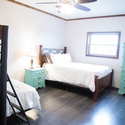 Sandstone Point Vacation Cabin - Bunk room with Queen bed, full bed and loft twin bed.