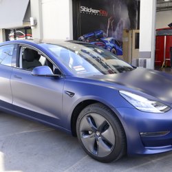 Photo of Sticker City - Sherman Oaks, CA, US. Xpel Stealth on blue Tesla Model 3 + chrome delete.