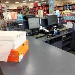 Shoe Dept - Just waiting on the 3 gossiping staff. The guy finally noticed and rang us out.