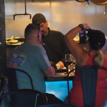 Flavour Kitchen & Wine Bar - Kitchen-side table - Wine Bars Near Me - Cocoa Beach, Florida Flavour Kitchen & Wine Bar - Kitchen-side table - Wine Bars Near Me - Cocoa Beach, Florida