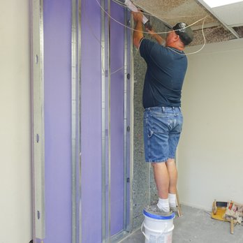 SDP Home Run Contracting - Building an independent wall next to a common wall for soundproofing. The new wall goes up past the hung ceiling, to the actual ceiling. - Drywall Installation & Repair Near Me - Corona, California