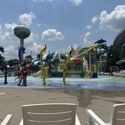 Splash Valley Water Park - The kiddie area, behind that 2 slides, lazy river and regular pool.