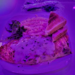 Infusion  Lounge - Philly Cheese steak omelet with a cheese sauce on it, grits and toast.