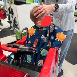 Jack & Jill Children's Salon - Elisa doing a great job cutting my boys' hair despite him being scared and crying