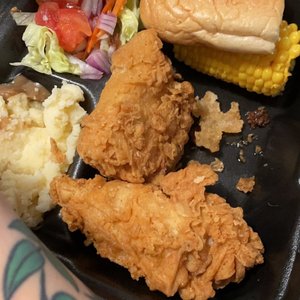 Photo of Doomie's Home Cookin' - Los Angeles, CA, United States. 3 piece fried chicken meal (minus one being eaten) comes with mashed, salad, corn on the cob and a roll.