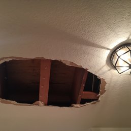 One of the holes in my ceiling, courtesy of Mannix Floors. One of the holes in my ceiling, courtesy of Mannix Floors.