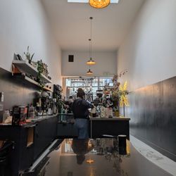 Excelsior Coffee - Interior, has one big table and a few bar style seats