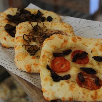 Vida Baking - two pieces of pizza on a piece of paper - Bakeries Near Me - Ashland, Oregon