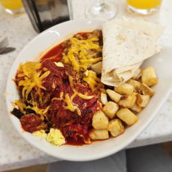Cornerstone Bakery & Cafe - Carne Adovada & Eggs ~ excellent flavors and perfect portions size!  (Slow roasted pork over 3 scrambled eggs topped with spicy red chile)