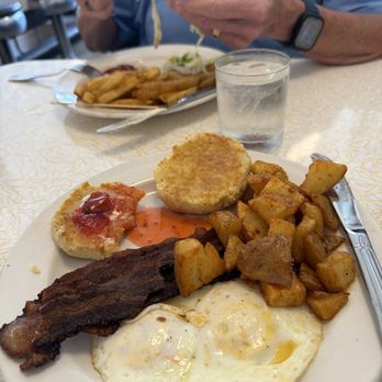 Tchotchke - 2 eggs bacon, home made biscuit and home fries. Grilled chicken sandwich MLT and French fries. - Breakfast & Brunch Near Me - St. Petersburg, Florida Tchotchke - 2 eggs bacon, home made biscuit and home fries. Grilled chicken sandwich MLT and French fries. - Breakfast & Brunch Near Me - St. Petersburg, Florida