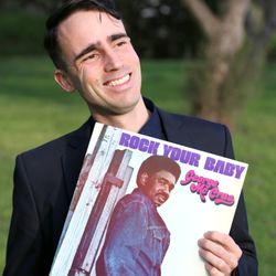 DJ Phil Does It - New profile photo for 2020, posing with a great record.