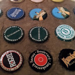 Bottle caps are embedded in the bar