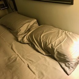Note the baggy pillowcases... they're at least 6 inches narrower and 6 inches shorter than standard king-sized pillows. Note the baggy pillowcases... they're at least 6 inches narrower and 6 inches shorter than standard king-sized pillows.