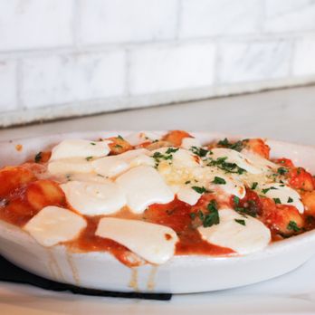 Carmelina's - Gnocchi al Forno ($18) tomato sauce, basil, mozzarella - Italian Near Me - Boston, Massachusetts Carmelina's - Gnocchi al Forno ($18) tomato sauce, basil, mozzarella - Italian Near Me - Boston, Massachusetts