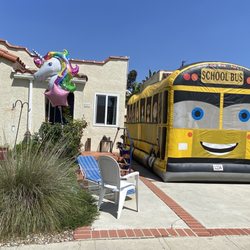 All Our Kids Jumpers and Party Rentals - Bus bounce house.